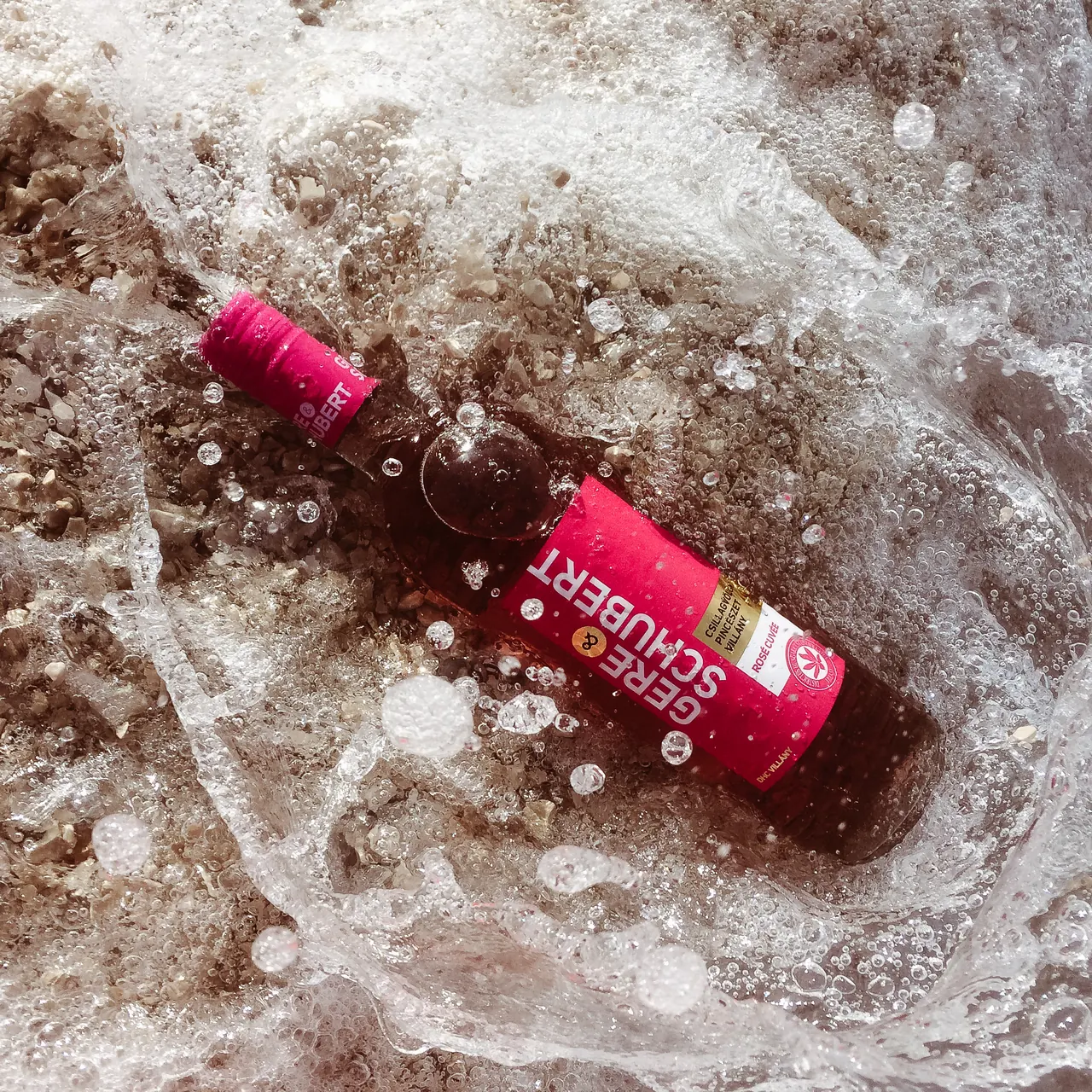 Gere & Schubert rosé bottle surrounded by ice and water