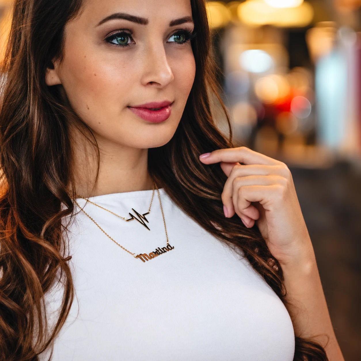 A model wearing a personalised Namely necklace at the photoshoot we organised for the brand